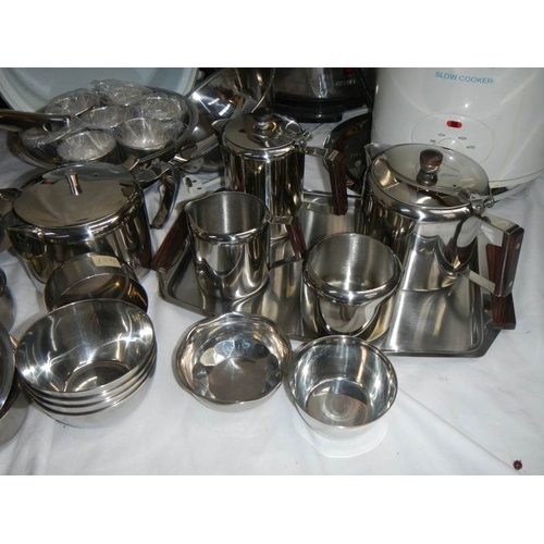 610 - A fantastic array of stainless steel pans, bowls etc including a Swan urn.