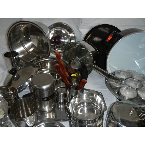 610 - A fantastic array of stainless steel pans, bowls etc including a Swan urn.