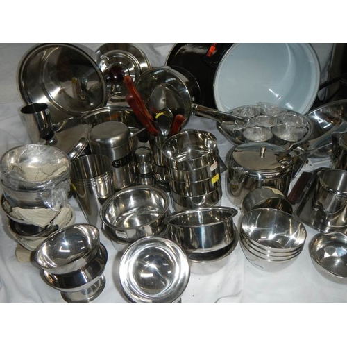 610 - A fantastic array of stainless steel pans, bowls etc including a Swan urn.