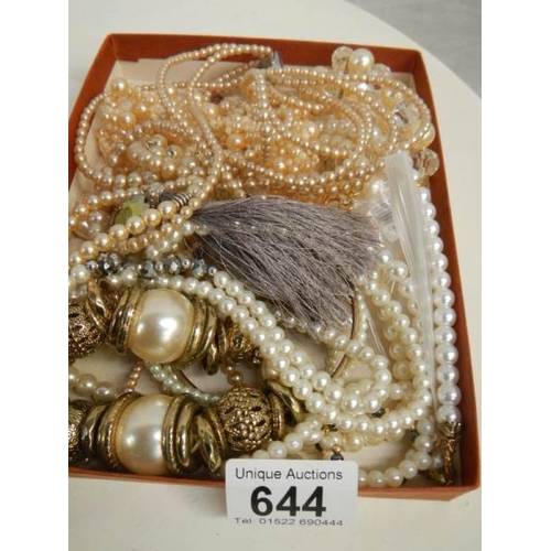 644 - A mixed lot of jewellery including simulated pearls.