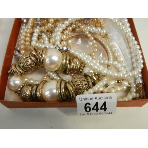 644 - A mixed lot of jewellery including simulated pearls.