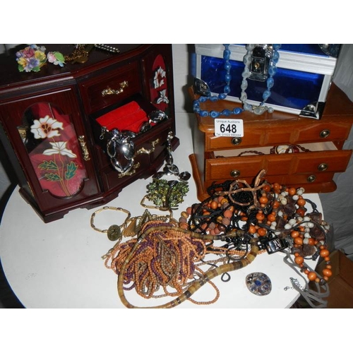 648 - A quantity of jewellery boxes and jewellery.