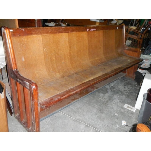 655 - A long old church pew, Approximately 210 cm wide.