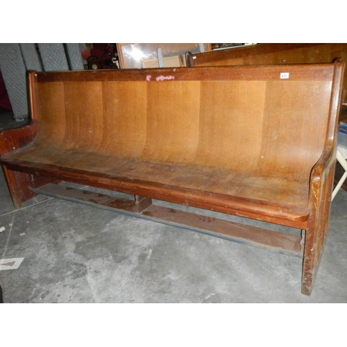 655 - A long old church pew, Approximately 210 cm wide.