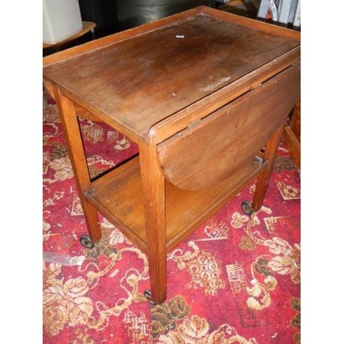 663 - A good mahogany drop leaf trolley with mahogany gallery.