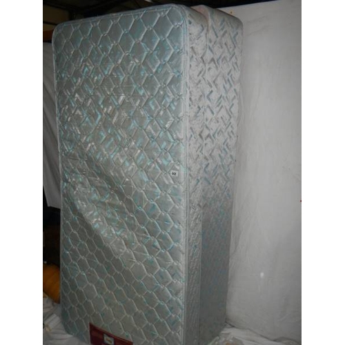 668 - A single bed base and mattress in good condition, 92 x 190 cm.