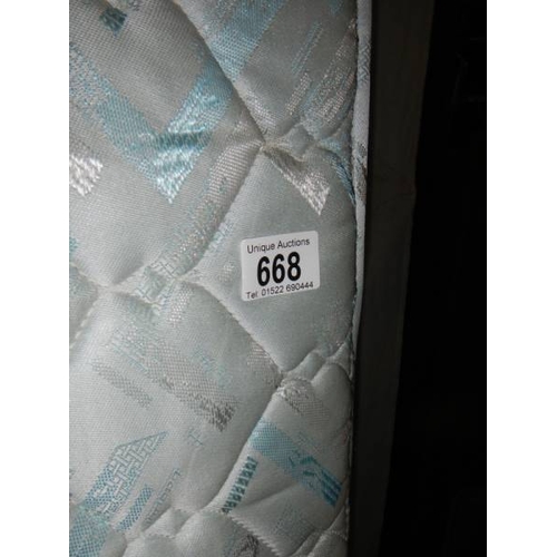 668 - A single bed base and mattress in good condition, 92 x 190 cm.