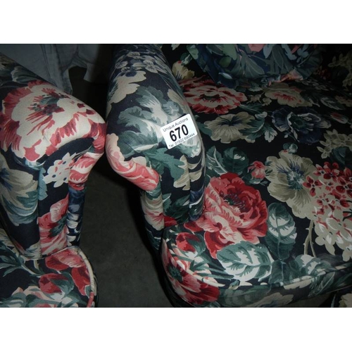 670 - A pair of matching arm chairs, matching stool and matching pouffe.