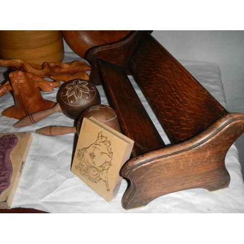 672 - A mixed lot of wooden items including 1920's book rack, printing blocks, bowl, vase etc.,