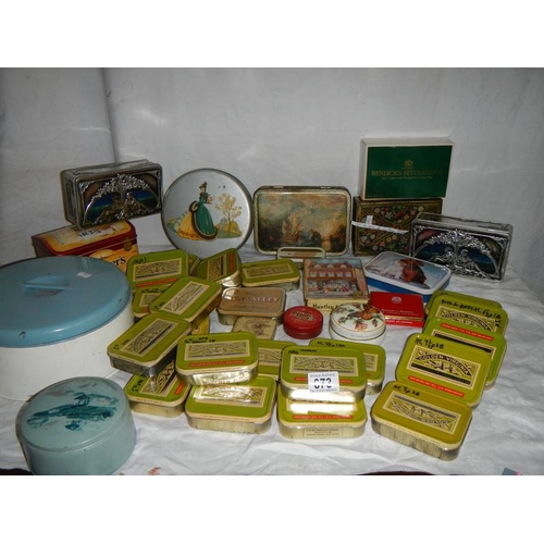 673 - A good mixed lot of old tins including round blue musical powder tin.