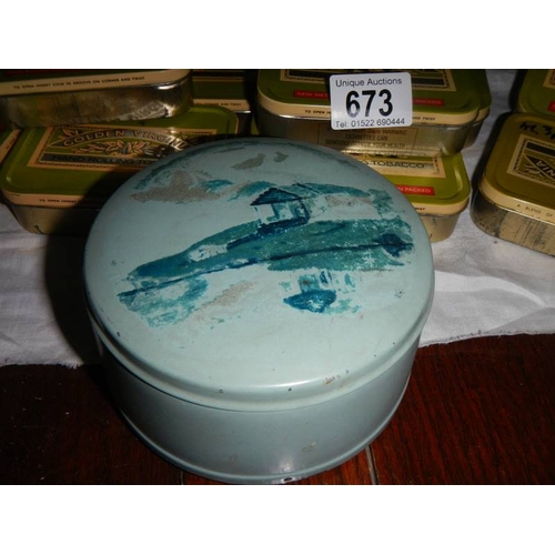 673 - A good mixed lot of old tins including round blue musical powder tin.