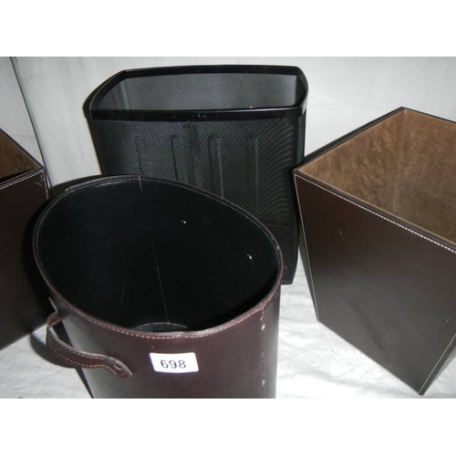 698 - 3 good hide covered waste paper bins and one other.