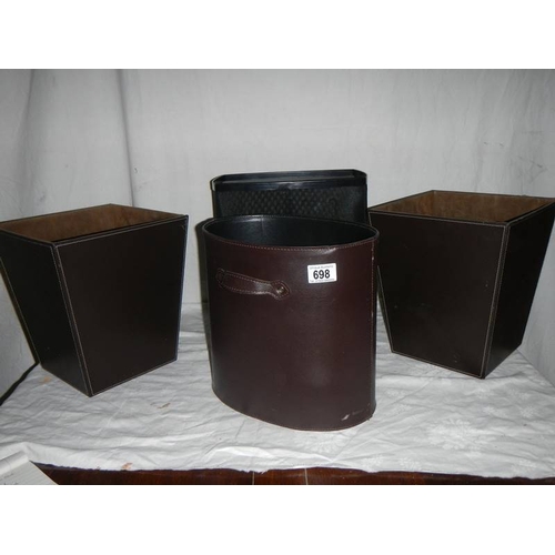 698 - 3 good hide covered waste paper bins and one other.