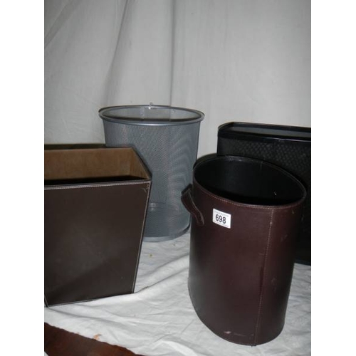 698 - 3 good hide covered waste paper bins and one other.