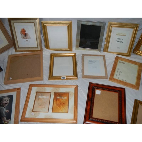 702 - 18 new photograph frames.