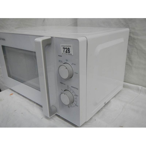 728 - A good clean Russell Hobbs microwave oven, in good condition.