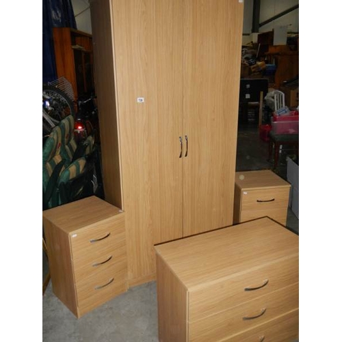 739 - A 4 piece bedroom suite comprising wardrobe and 3 x 3 drawer chests.