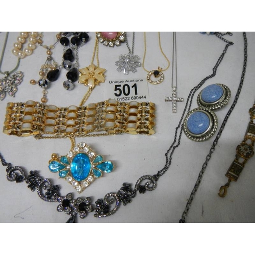 501 - A good mixed lot of costume jewellery including a glass clock, 25 items.