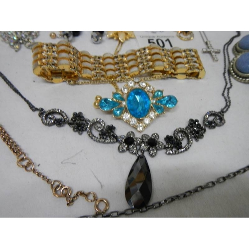 501 - A good mixed lot of costume jewellery including a glass clock, 25 items.