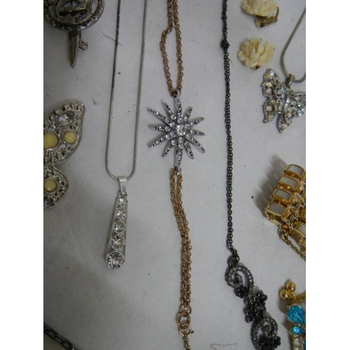 501 - A good mixed lot of costume jewellery including a glass clock, 25 items.