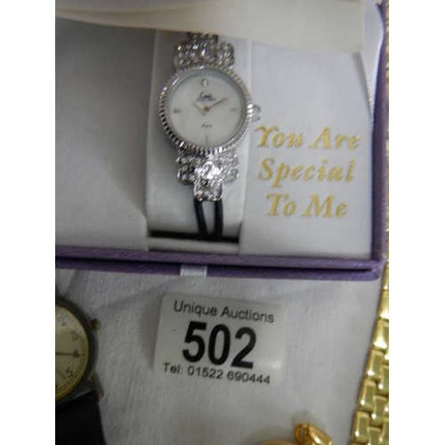 502 - A good lot of Ladies and Gents watches including a 2 piece clock.