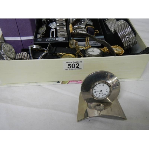 502 - A good lot of Ladies and Gents watches including a 2 piece clock.