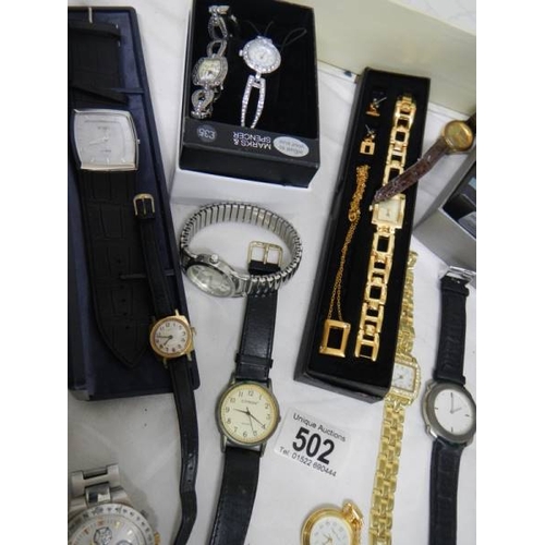 502 - A good lot of Ladies and Gents watches including a 2 piece clock.