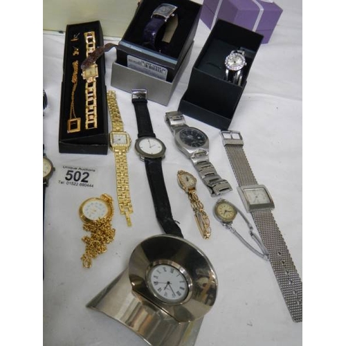 502 - A good lot of Ladies and Gents watches including a 2 piece clock.