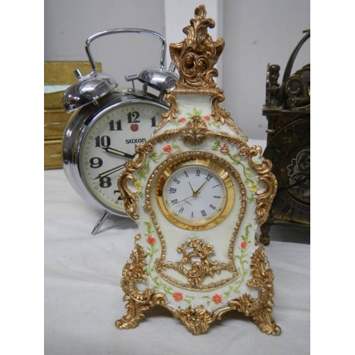 509 - A small lot of assorted mantel clocks including brass lantern clock (bell present but not fitted).