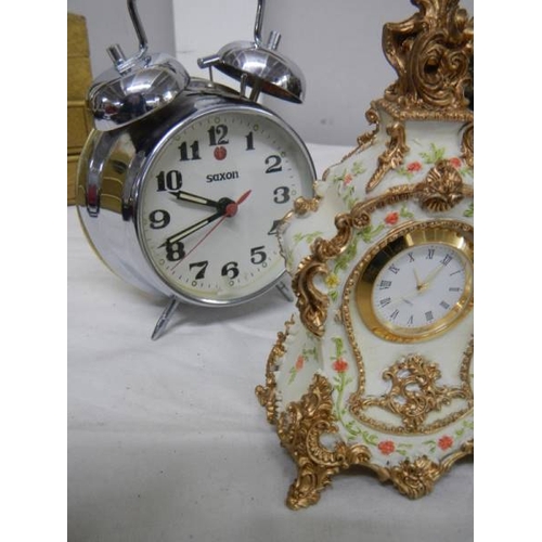 509 - A small lot of assorted mantel clocks including brass lantern clock (bell present but not fitted).