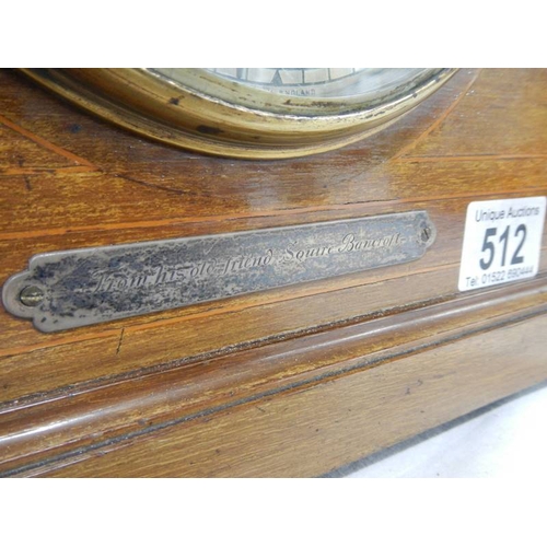 512 - A mahogany mantel clock with key (springs ok).