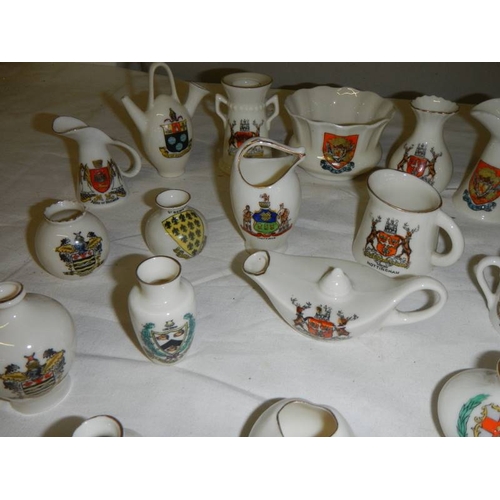 513 - 21 pieces of assorted crested china, all in good condition.