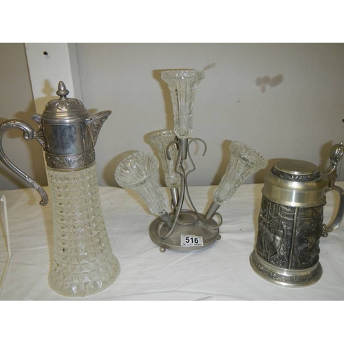 516 - A four trumpet glass and EPNS eperge, a glass claret jug with plated top and a beer stein with stag,... 