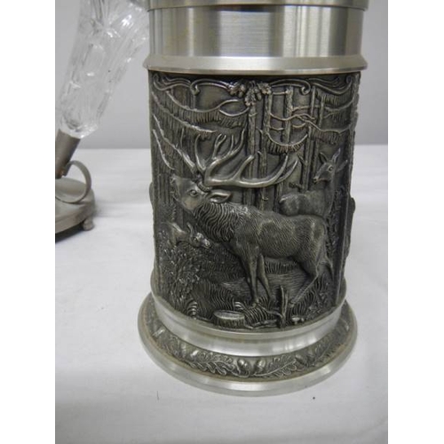 516 - A four trumpet glass and EPNS eperge, a glass claret jug with plated top and a beer stein with stag,... 