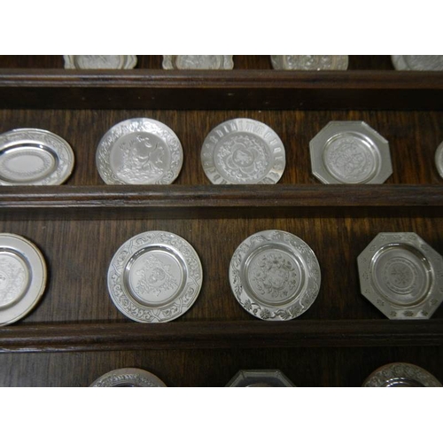 527 - 24 miniature historical English silver plates (should be a set of 25 but one missing).