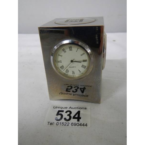 534 - A small three sided clock/thermometer/hydrometer, 7 cm tall.