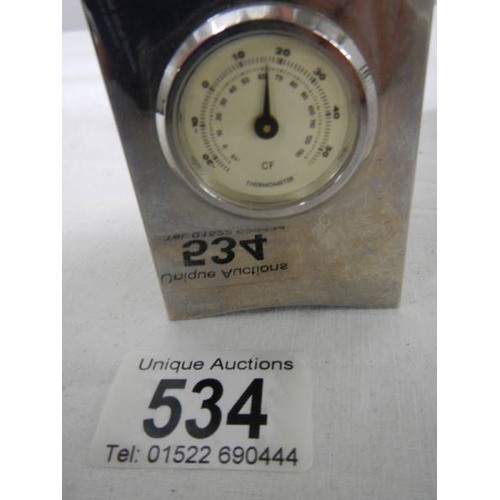 534 - A small three sided clock/thermometer/hydrometer, 7 cm tall.