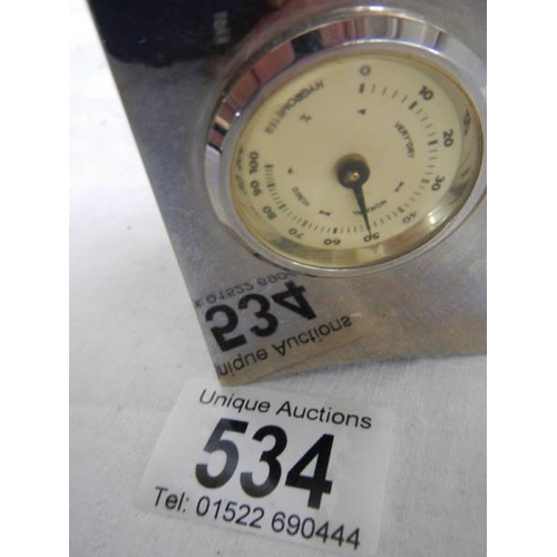 534 - A small three sided clock/thermometer/hydrometer, 7 cm tall.