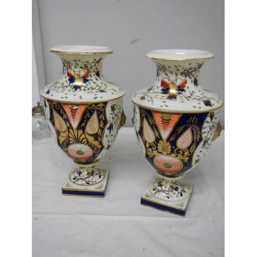 537 - A pair of Crown Derby style vases (heavily restored).