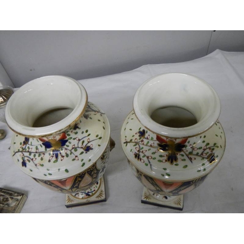 537 - A pair of Crown Derby style vases (heavily restored).