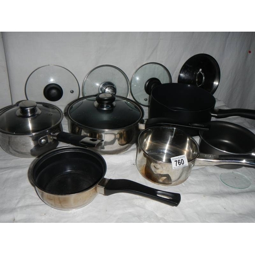 760 - A mixed lot of clean saucepans, some with lids and some spare lids.