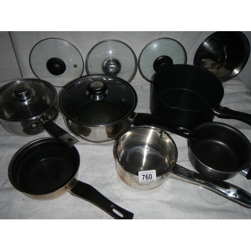 760 - A mixed lot of clean saucepans, some with lids and some spare lids.