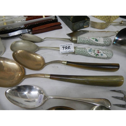 786 - A good lot of silver plate including cutlery, servers, toast rack, sugar scoop etc.,