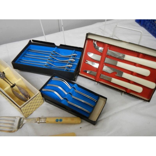 786 - A good lot of silver plate including cutlery, servers, toast rack, sugar scoop etc.,