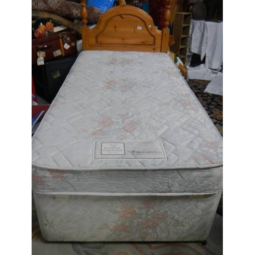 798 - A 3ft divan bed with pine headboard, in clean condition.