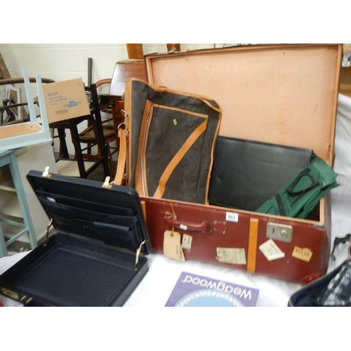 803 - A mixed lot including picnic set, cases, briefcase, Wedgwood plate etc.,