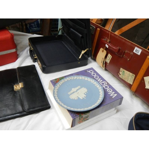 803 - A mixed lot including picnic set, cases, briefcase, Wedgwood plate etc.,