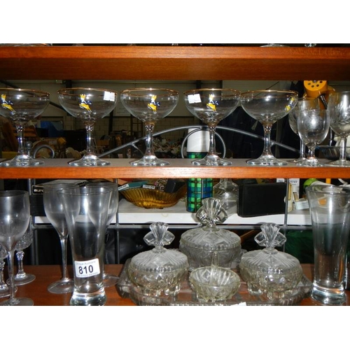 810 - A large lot of assorted glass ware including decanter, Babycham glasses, cut glass etc.,