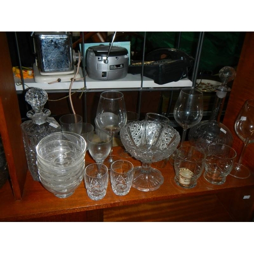 810 - A large lot of assorted glass ware including decanter, Babycham glasses, cut glass etc.,