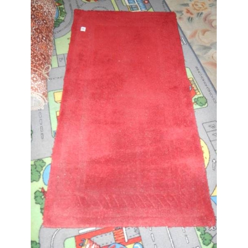 811 - A road layout rug 100 x 200 cm, a red rug 120 x 60 cm and a Chinese rug 160 x 100 cm.